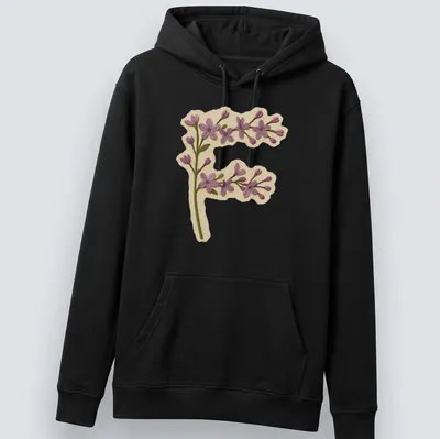 Vintage floral shirt featuring a large letter F adorned with purple lilac flowers. — printed on a unisex hoodie
