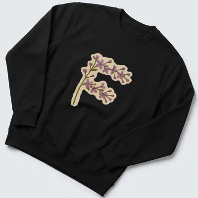 Vintage floral shirt featuring a large letter F adorned with purple lilac flowers. — printed on a unisex sweatshirt