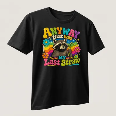 Colorful cartoon raccoon holding a straw with humorous text above. — printed on a unisex t-shirt (angled view)