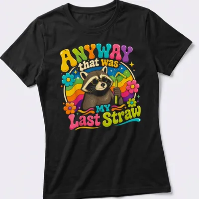 Colorful cartoon raccoon holding a straw with humorous text above. — printed on a women's shirt