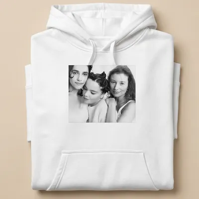 Black and white portrait of Bjork, PJ Harvey, and Tori Amos on — printed on a unisex hoodie