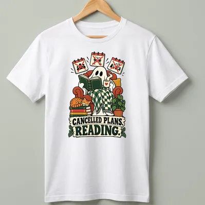 Whimsical ghost reading a book with text 'CANCELLED PLANS. READING.' in playful design — printed on a unisex t-shirt