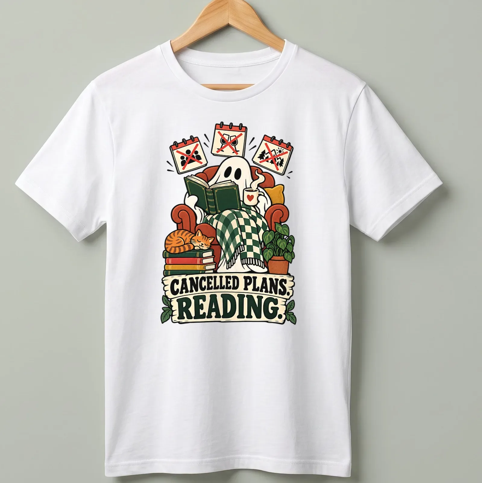 Whimsical ghost reading a book with text 'CANCELLED PLANS. READING.' in playful design — printed on a unisex t-shirt