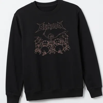 Cartoon-style print of drummer Benson playing loudly with brown and white colors — printed on a unisex sweatshirt