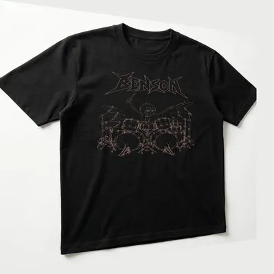 Cartoon-style print of drummer Benson playing loudly with brown and white colors — printed on a unisex t-shirt (angled view)