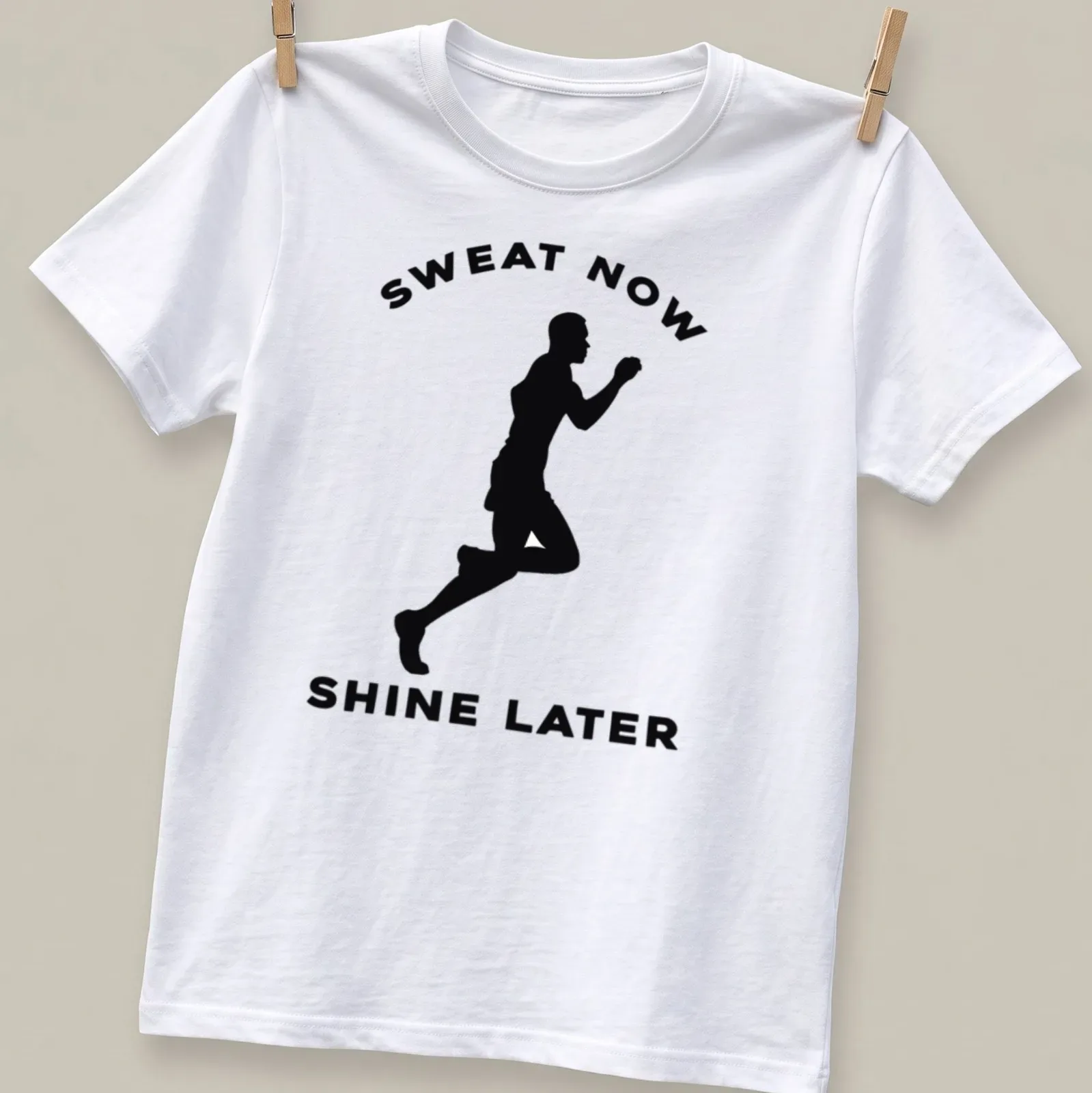 Motivational t-shirt featuring bold text and a runner silhouette in black and white. — printed on a unisex t-shirt