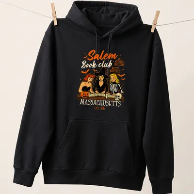 Vintage cartoon design of witches reading books with colorful text — printed on a unisex hoodie