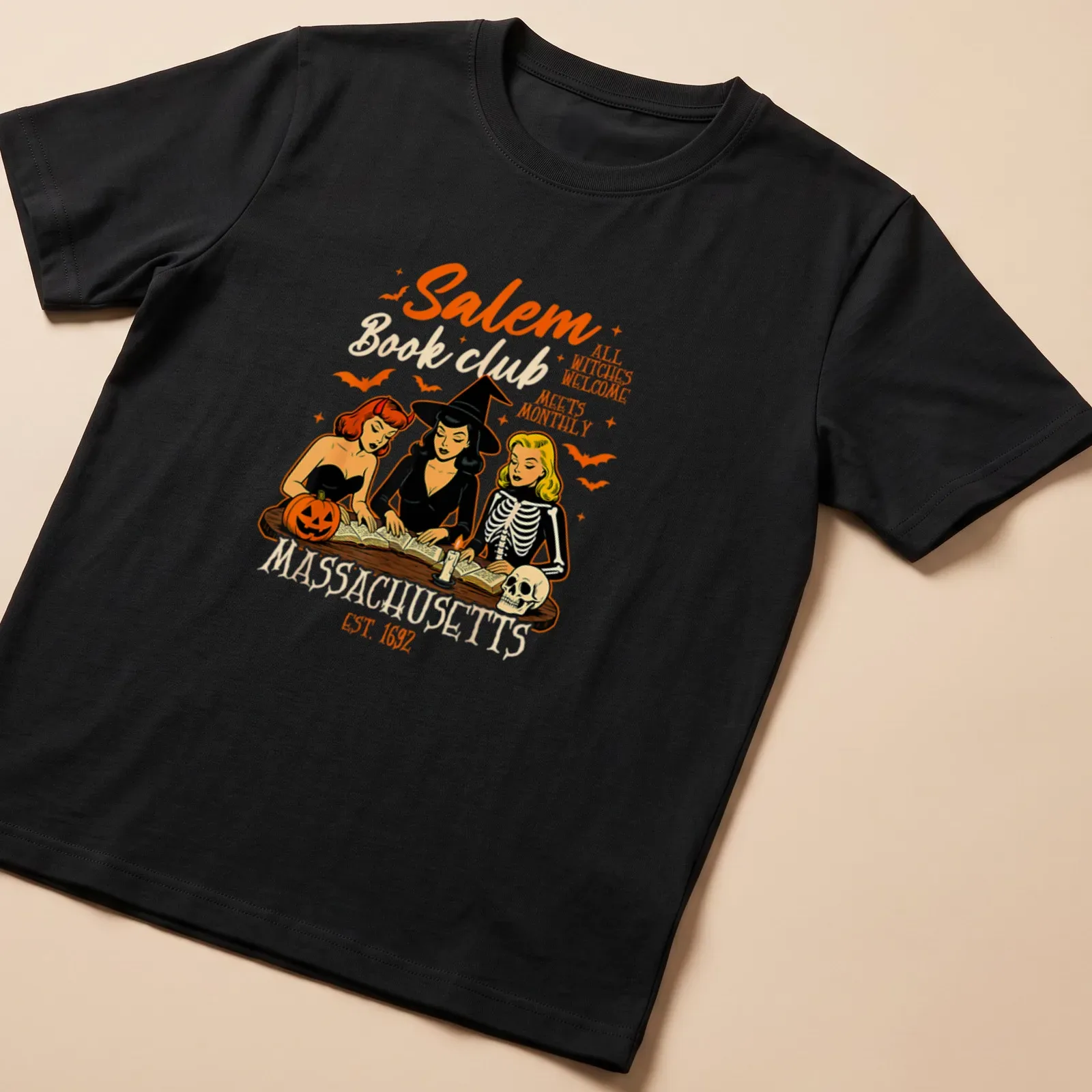Vintage cartoon design of witches reading books with colorful text — printed on a unisex t-shirt