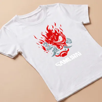 Bold graphic of a samurai mask with flames and the word Samurai in red and grey — printed on a women's shirt