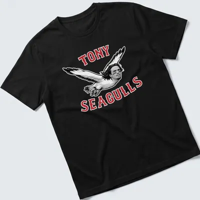 Bold graphic tee featuring seagulls with a man's face and playful slogan