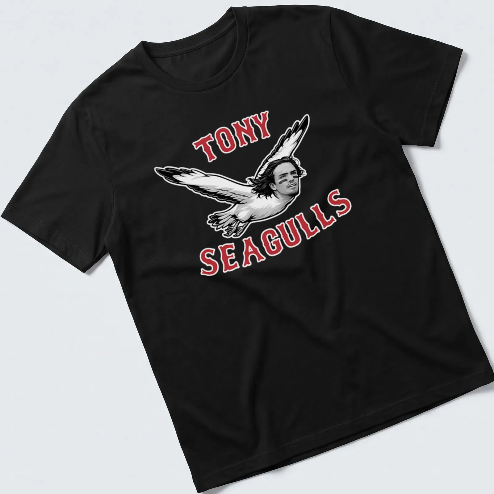 Bold graphic tee featuring seagulls with a man's face and playful slogan — printed on a unisex t-shirt