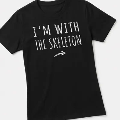 Bold text 'I'm with the skeleton' in white with a skeleton graphic — printed on a women's shirt