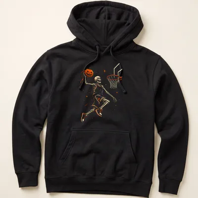 Illustrative Halloween t-shirt featuring a skeleton playing basketball with a pumpkin — printed on a unisex hoodie