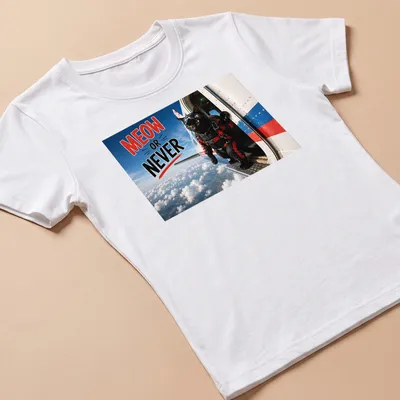 Realistic print of a skydiving cat with Meow Or Never text in bright colors — printed on a women's shirt