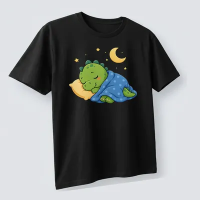 Kawaii sleeping dinosaur graphic in green, blue, and yellow tones — printed on a unisex t-shirt (angled view)