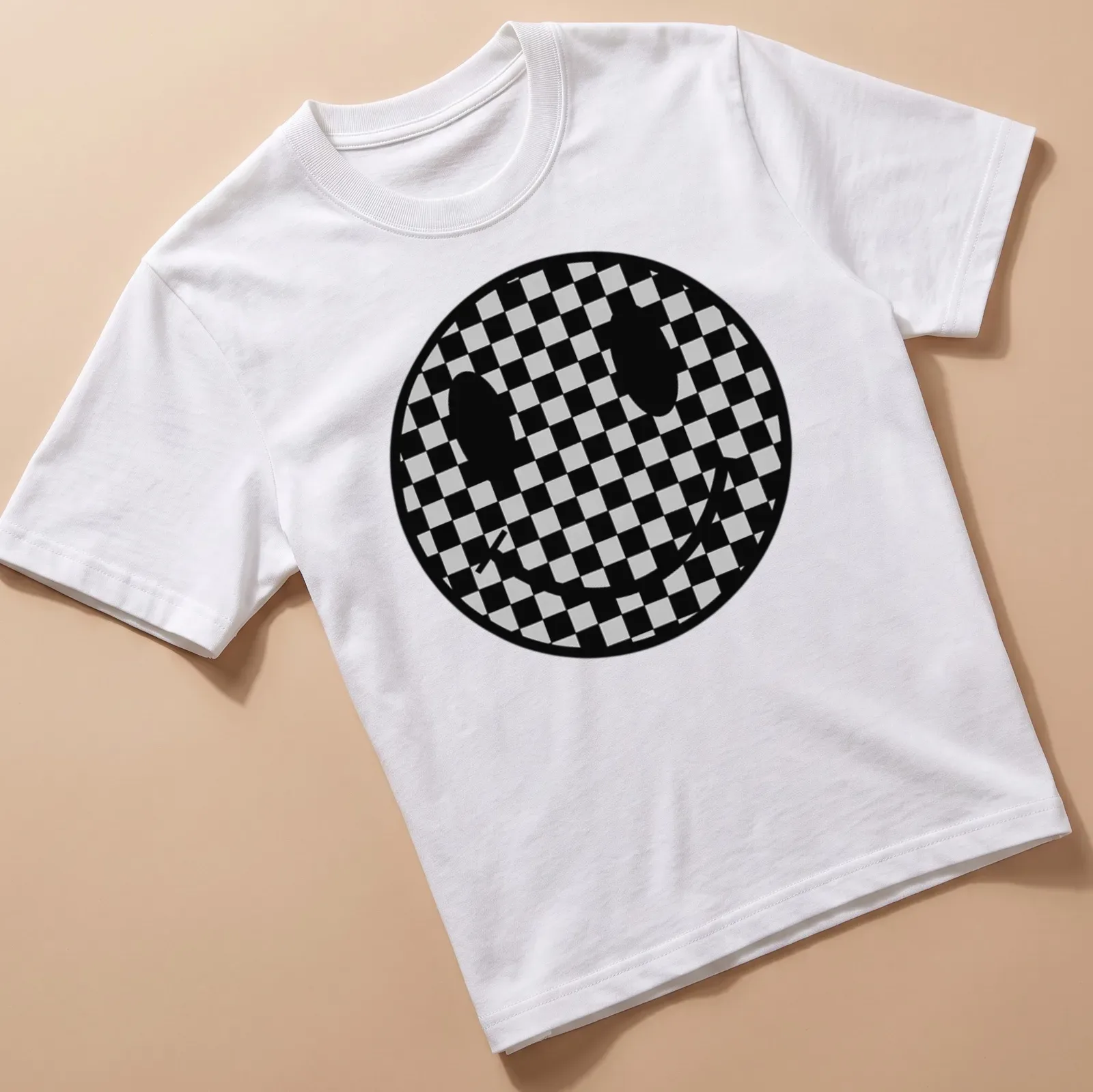 Checkerboard pattern featuring a playful smiley face in black and grey — printed on a unisex t-shirt