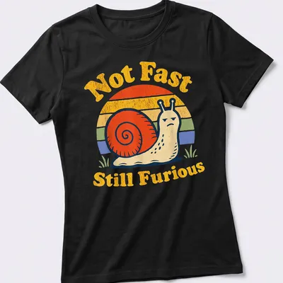 Retro vintage snail design with the phrase Not Fast Still Furious in bright colors — printed on a women's shirt