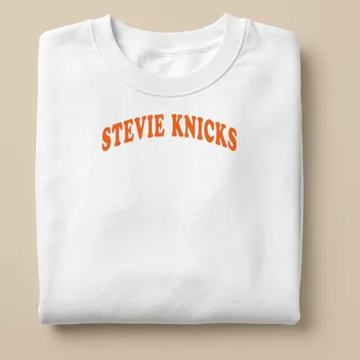 Bold retro Stevie Knicks t-shirt with orange and white lettering — printed on a unisex sweatshirt