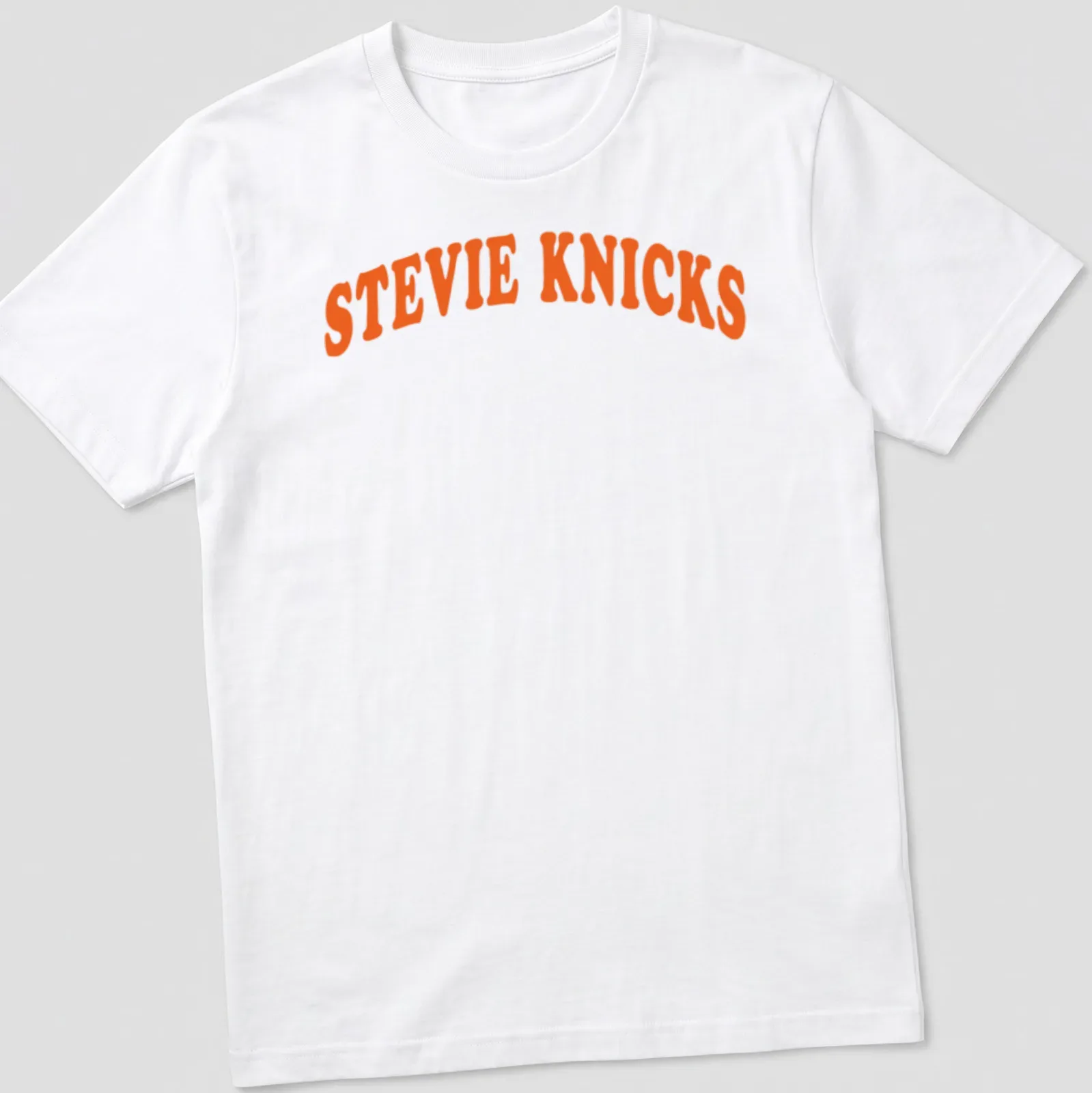 Bold retro Stevie Knicks t-shirt with orange and white lettering — printed on a unisex t-shirt