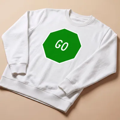 Graphic t-shirt featuring a green stop sign with the word GO in bold white letters — printed on a unisex sweatshirt