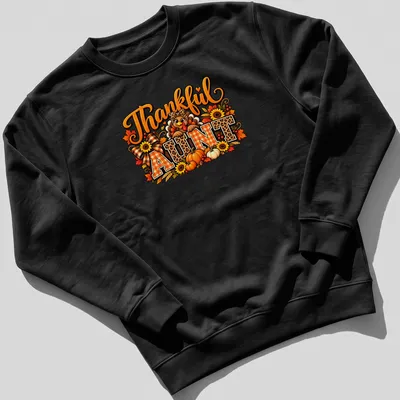 Colorful Thanksgiving t-shirt featuring a turkey and plaid/leopard prints with 'Thankful AUNT' text — printed on a unisex sweatshirt