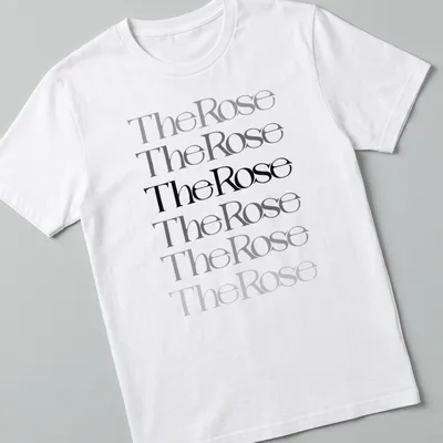 Modern typography T-shirt featuring "The Rose" text and a rose illustration in black, gray, and white.