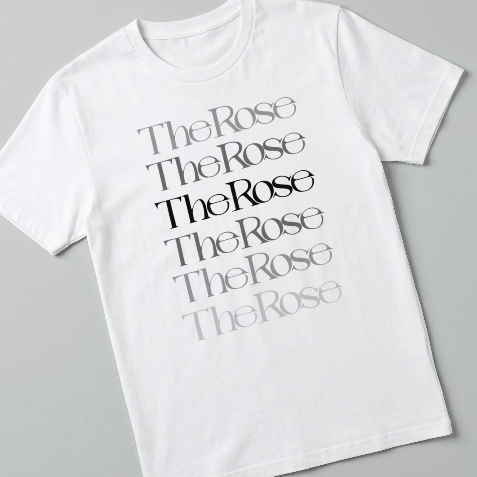 Modern typography T-shirt featuring "The Rose" text and a rose illustration in black, gray, and white. — printed on a unisex t-shirt
