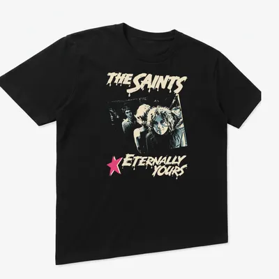 Distressed retro print featuring The Saints with light blue, pink, and cream colors — printed on a unisex t-shirt (angled view)