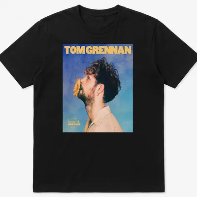 Vintage-style Tom Grennan Gospel Version t-shirt with blue, yellow, and beige colors.