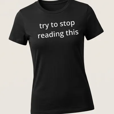 Bold white text reads 'try to stop reading this' on a black — printed on a women's shirt