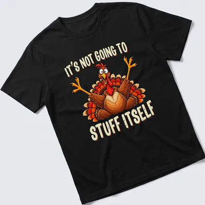 Cartoon turkey with humorous text about stuffing on a colorful Thanksgiving tee.