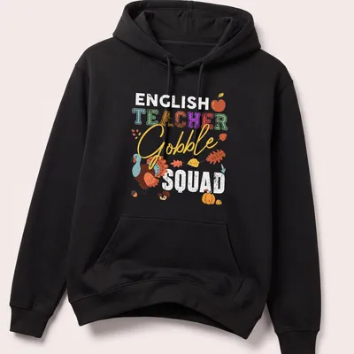 Playful turkey illustration with colorful text 'TEACHER Gobble' for Thanksgiving — printed on a unisex hoodie