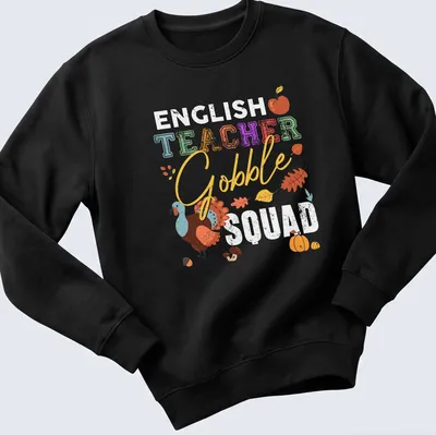 Playful turkey illustration with colorful text 'TEACHER Gobble' for Thanksgiving — printed on a unisex sweatshirt