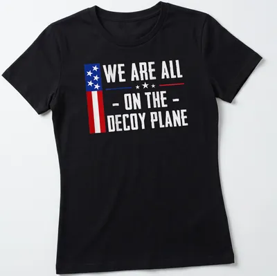 Vintage US flag t-shirt with the text 'We Are All - On The - Decoy Plane' — printed on a women's shirt