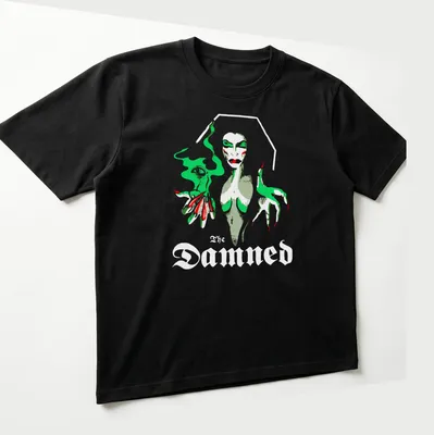 Illustrative Vampira graphic with the text 'The Damned' in green, red, gray, and white — printed on a unisex t-shirt (angled view)
