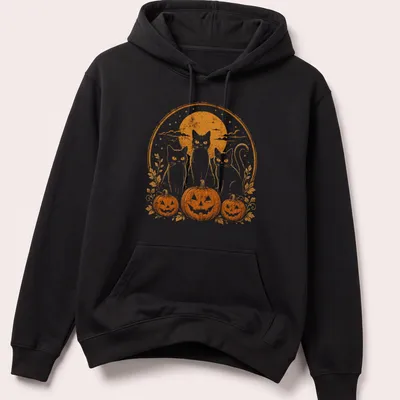 Vintage retro print of three black cats by pumpkins under moonlight — printed on a unisex hoodie