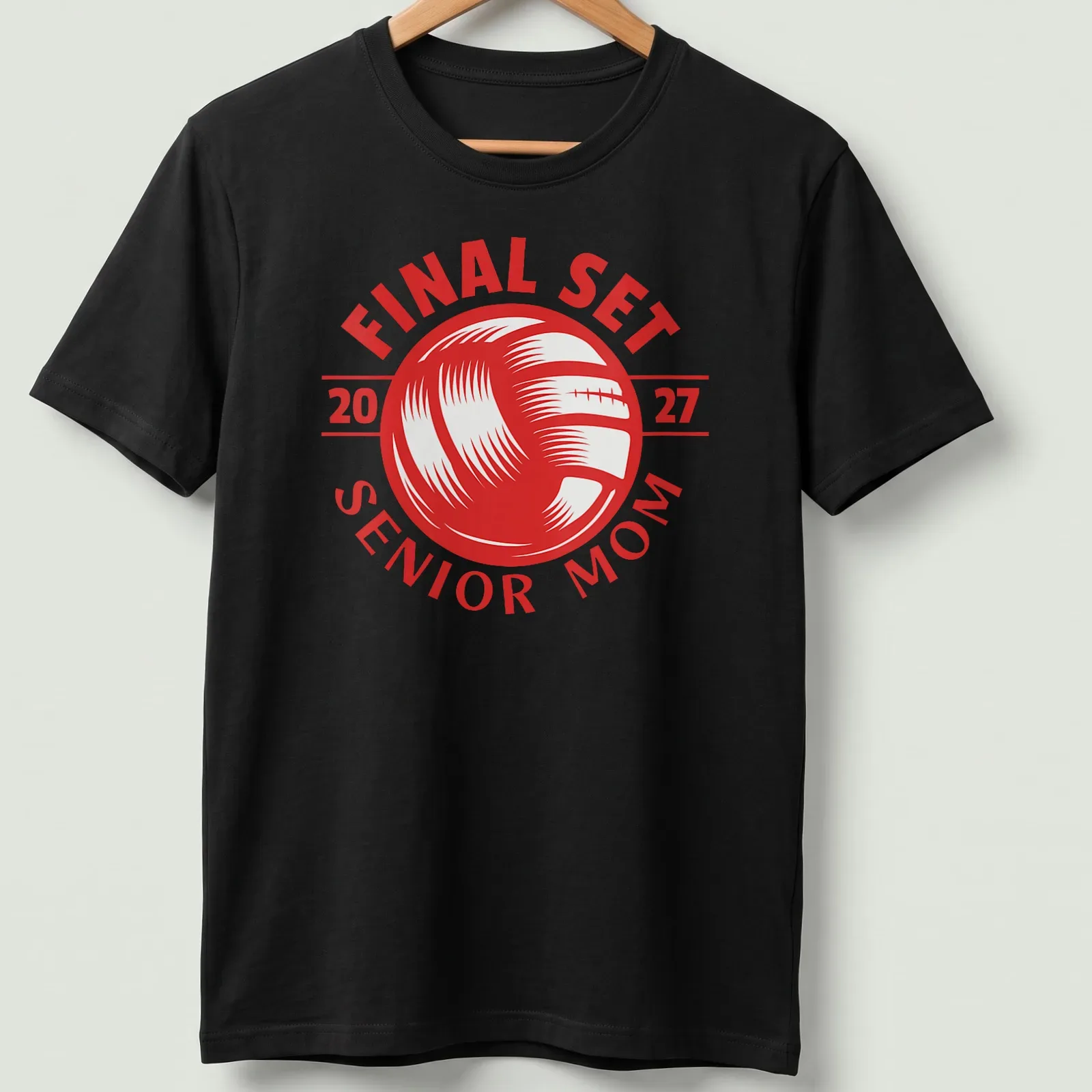 Bold graphic t-shirt celebrating volleyball Senior Mom 2027 with red and white text — printed on a unisex t-shirt