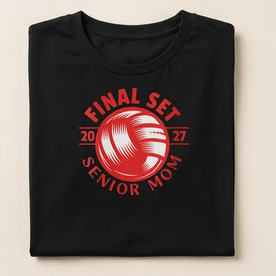 Bold graphic t-shirt celebrating volleyball Senior Mom 2027 with red and white text — printed on a women's shirt