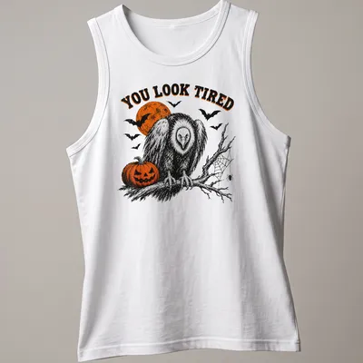 Vintage Halloween vulture illustration with pumpkin and text reading 'YOU LOOK TIRED' — printed on a tank top