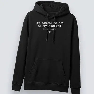 Retro shirt with sun illustration and humorous text about heat and husbands — printed on a unisex hoodie