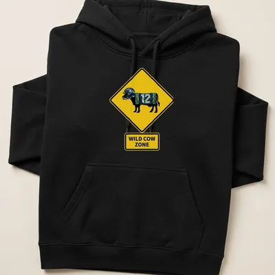 Cartoon cow in a Seattle Seahawks jersey with text 'Wild Cow Zone' in bold letters — printed on a unisex hoodie