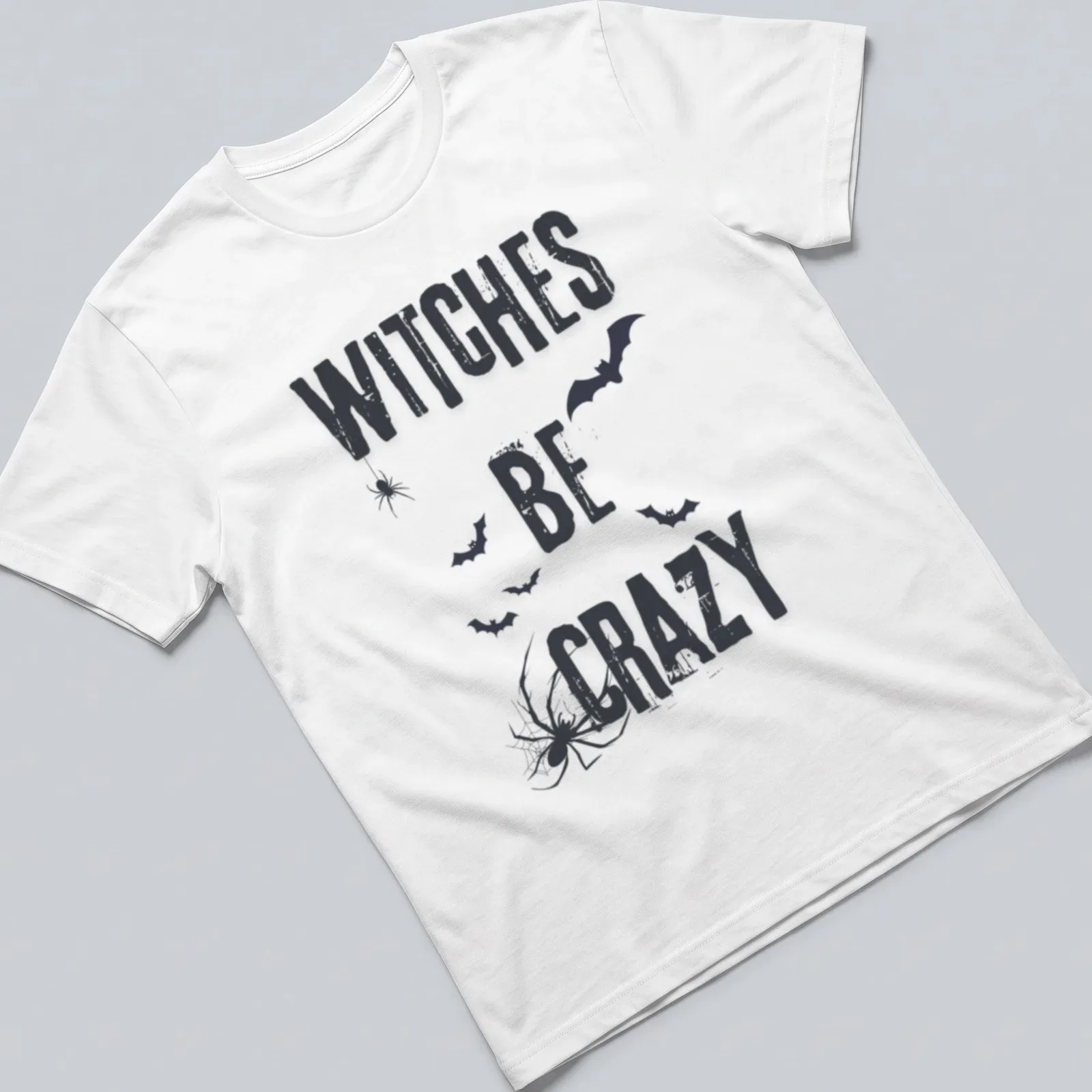 Grunge style Halloween shirt featuring bats, spider, and 'Witches Be Crazy' text. — printed on a unisex t-shirt