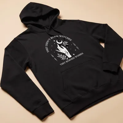 Minimalist design featuring a hand with flowers and a crescent moon alongside bold text — printed on a unisex hoodie