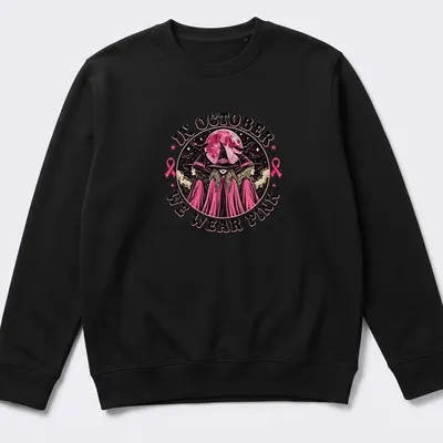 Vintage gothic t-shirt featuring witches and text about wearing pink in October — printed on a unisex sweatshirt
