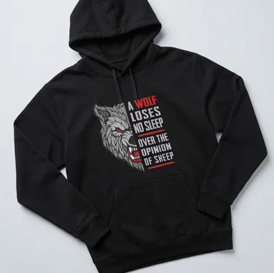 Bold graphic t-shirt with the phrase about a wolf and sheep, featuring a striking color palette. — printed on a unisex hoodie