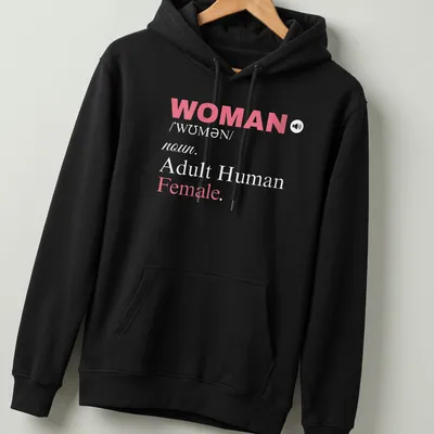 Bold typography t-shirt featuring a definition of womanhood in pink and white — printed on a unisex hoodie