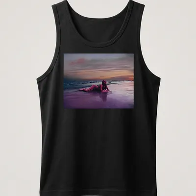 Dreamy surreal print of a woman on a beach at sunset with vibrant colors — printed on a tank top