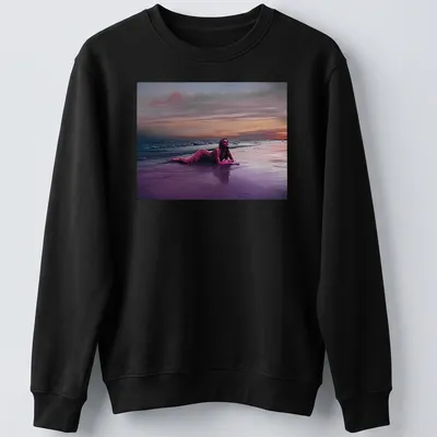 Dreamy surreal print of a woman on a beach at sunset with vibrant colors — printed on a unisex sweatshirt