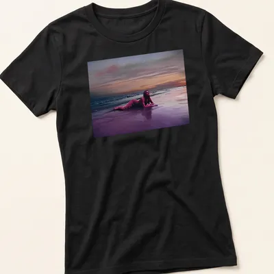 Dreamy surreal print of a woman on a beach at sunset with vibrant colors — printed on a women's shirt