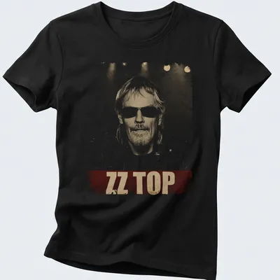 Vintage distressed t-shirt featuring a bold ZZ Top print with Frank Beard's illustration — printed on a women's shirt